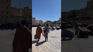 Walking at Rcif square in the medina of Fes