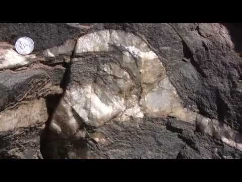 Can glass scratch feldspar?
