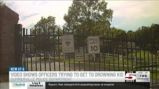 VIDEO: New video shows Summerville police officers battling gate as child drowns