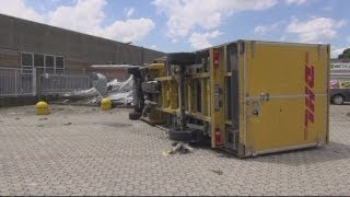 Milan tornado: Lorries overturned as rare twister hits Italian city