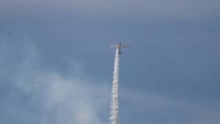 Chris Thomas Airshows and his SNJ-2 Texan going into a loop in the distance