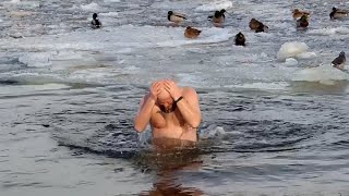 Kiev residents bathe in Dnieper River to mark Epiphany