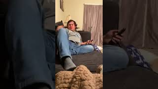 Guy has an accident in his pants while laughing at something on TV!