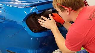 Mustang getting Luxe Lightwrap Dark smoke film applied to taillights