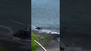 Surfers on Reunion Island flee chopper; escape into jungle