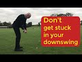 Don't get your arms stuck in your downswing