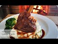 Lamb Shank with buttery, fluffy mashed potatoes, veggies and silky smooth gravy.