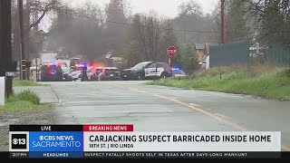 Carjacking suspect barricaded in Sacramento County home