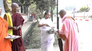 Ven. Saccananda and his mom and Ven. AriyaKitthi Bhante offered donation to Nuns (Part III).