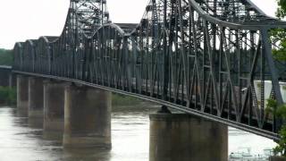 BNSF 4813 leads a KCS stack across the Mississippi river 08/01/2010 ©