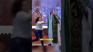 Lady pushes Catholic Priest off a stage while preaching 😲 #shorts