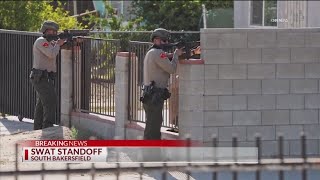 S.W.A.T. standoff ends with self-inflicted gunshot wound on East Planz Road