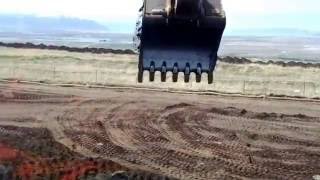 In the cab of a Caterpillar 345B mass excavator