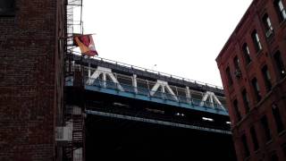 SF Giants flag under Manhattan Bridge - Opening Day