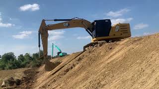 Skillful Excavation: Komatsu PC-210 Loading Trucks Seamlessly