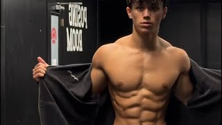 17 years old teen boy flexing muscle