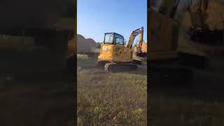 unloading hay with the Cat 306 next gen