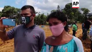 Dozens of coffins arrive at Brazil mass grave