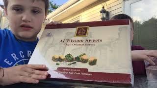 Trying Syrian sweets with my cousin (name in the description below)