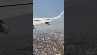 Tuifly Belgium take off over the city of Antwerp with E-jet 190