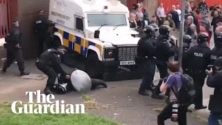 Belfast riot police clash with youths in stand-off over republican bonfire