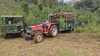 girl agricultural machine driver, driving wood loader back to assembly point