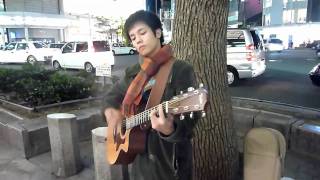 Japanese singer performing on the street of Osaka