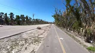 Bicycling on West Gulf Drive, Sanibel Island (March 2023) - Advance to 6:30 to see buildings.