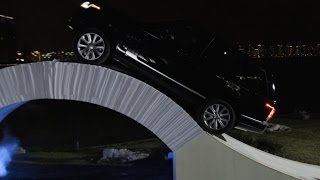 Car Drives Over Bridge Made of Paper