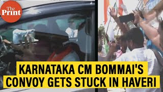 Karnataka CM Bommai's convoy gets stuck in Haveri as Congress workers celebrate on the route