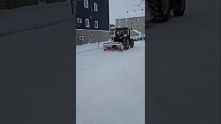 Tractor Snow Blower Clearing Snow