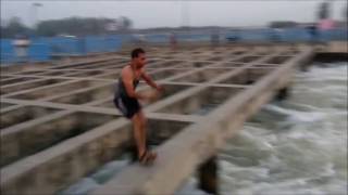 11 Boys diving in the Ganga canal India