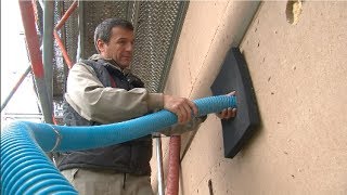 Insulating a wall with air injected insulation STEICOzell