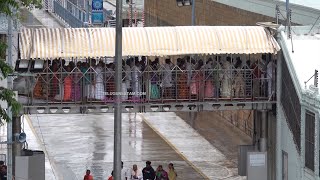 Devotees Of Lord Venkateswara Standing In Tirumala Queue During Rain