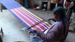 Weaving a scarf in the ancient technique of discontinuous warp.