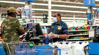 Walmart sees sales slowing in 2022, raises wages