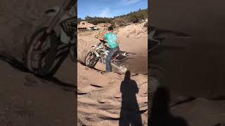 My uncles dirt bike got stuck in sand.