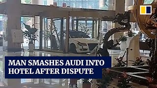 Man in China smashes Audi into hotel after dispute with staff