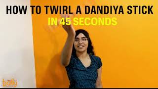 How To Twirl/Spin a Dandiya/Raas Stick Tutorial in 45 Seconds - How to spin a stick