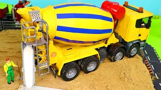 A Concrete Mixer and other Toy Vehicles