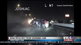 Caught on camera: Drivers help rescue man in burning car