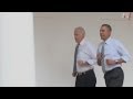 Barack Obama and Joe Biden run round the White House