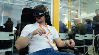 VR conference visitor tests virtual reality helmet