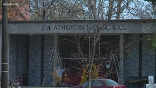 Two JCPS students from different schools found with gun on school property