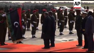 Sudan's President Omar al-Bashir is welcomed by NTC leaders