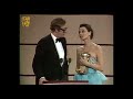 Audrey Hepburn presents Michael Caine with his BAFTA in 1984