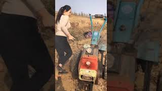 A woman starts the engine of a cultivator at once.#shorts