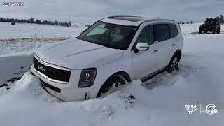 Volunteers work to dig out stranded cars in Elizabeth, Limon after historic snowstorm