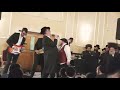 michoel schnitzler and rafi the king rocking at a wedding in monsey