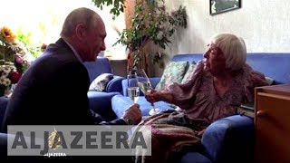 Russian human rights leader gets surprise birthday visit from Putin